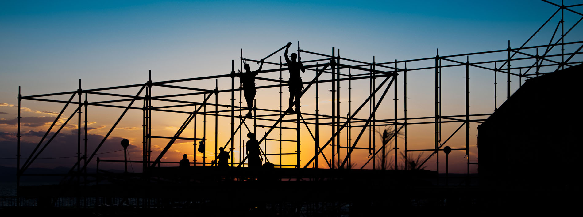 Construction,Workers,Working,On,Scaffolding.